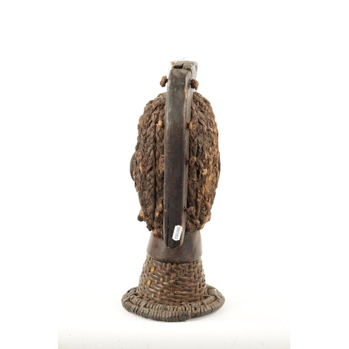 393 - AN OLD AFRICAN WICKER AND PARDIMENT TRIBAL HEAD POSSIBLY YORUBA (41cm high)