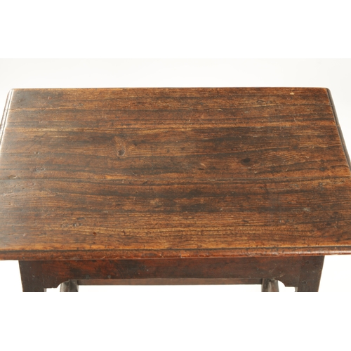 395 - AN EARLY 18TH CENTURY OAK AND ELM RECTANGULAR TABLE with overhanging top and ring turned supports. (... 