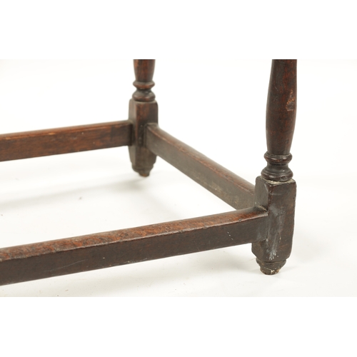 395 - AN EARLY 18TH CENTURY OAK AND ELM RECTANGULAR TABLE with overhanging top and ring turned supports. (... 