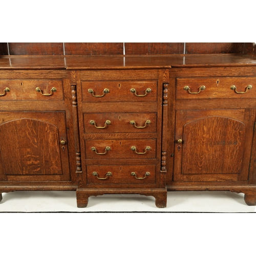 407 - A LATE 18TH CENTURY WELSH OAK DRESSER AND RACK with breakfront base having fitted drawers and side c... 