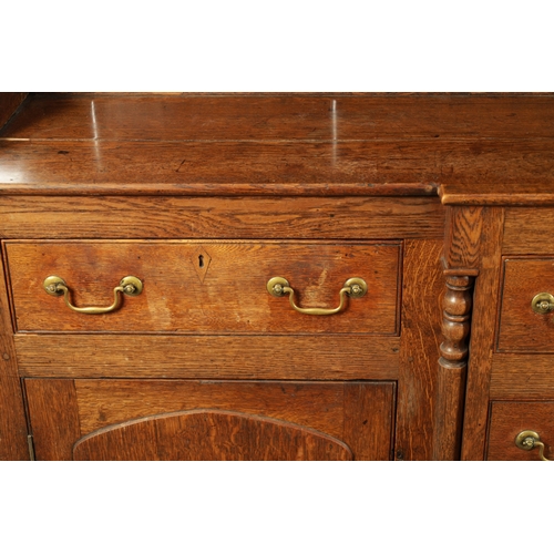 407 - A LATE 18TH CENTURY WELSH OAK DRESSER AND RACK with breakfront base having fitted drawers and side c... 