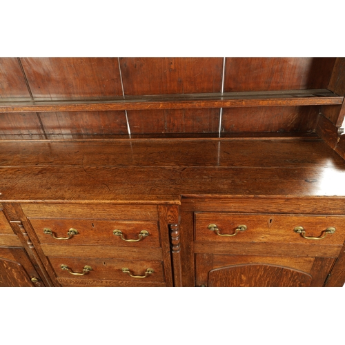 407 - A LATE 18TH CENTURY WELSH OAK DRESSER AND RACK with breakfront base having fitted drawers and side c... 