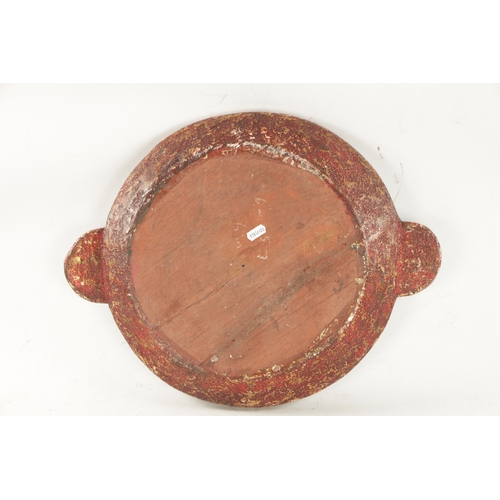 408 - AN ANTIQUE INDIAN CARVED BOWL with painted decoration (50cm wide)