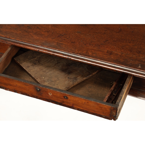 410 - A GEORGE I WALNUT SILVER TABLE with shallow frieze drawer, fitted candle slides and raised on cabrio... 