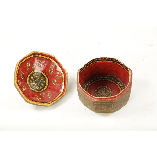 417 - AN ANTIQUE KASHMIRE PAINTED OCTAGONAL BOX with turned bone finial (13cm wide 10cm high)