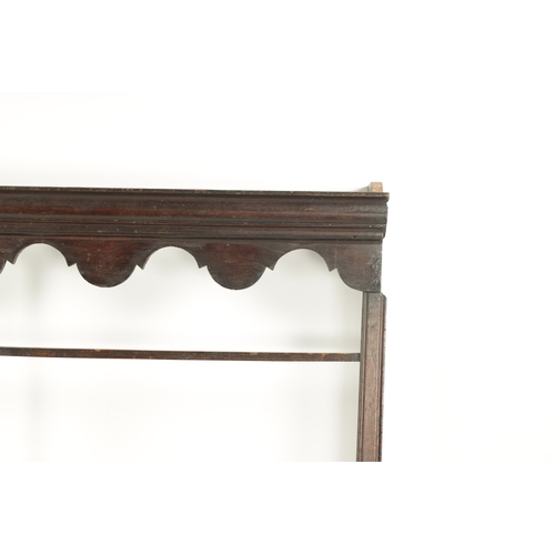 421 - AN 18TH CENTURY OAK HANGING DELFT RACK with wavy edge moulded top and open shelves. (128cm wide 127c... 