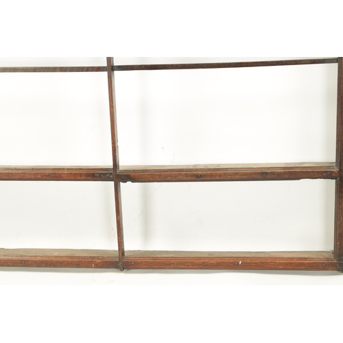 421 - AN 18TH CENTURY OAK HANGING DELFT RACK with wavy edge moulded top and open shelves. (128cm wide 127c... 