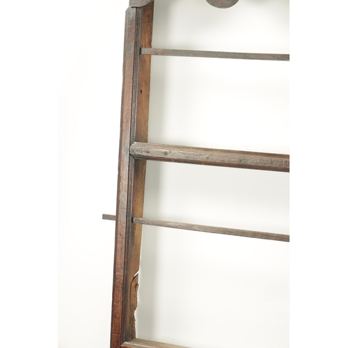 421 - AN 18TH CENTURY OAK HANGING DELFT RACK with wavy edge moulded top and open shelves. (128cm wide 127c... 