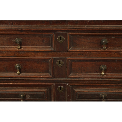 428 - AN UNUSUAL 17TH CENTURY JACOBEAN MOULDED FRONT OAK CHEST OF DRAWERS with hinged top above three moul... 