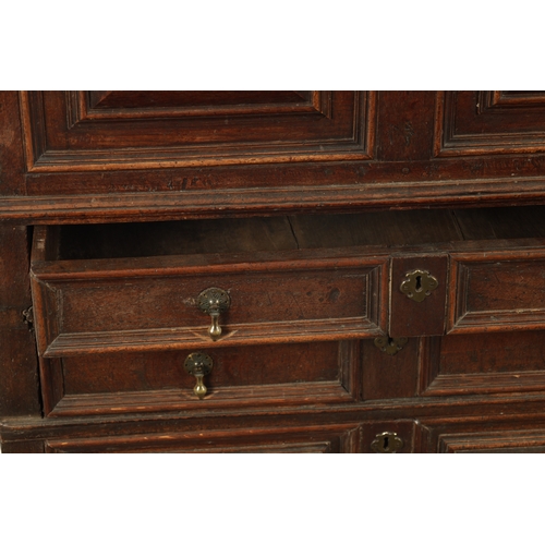 428 - AN UNUSUAL 17TH CENTURY JACOBEAN MOULDED FRONT OAK CHEST OF DRAWERS with hinged top above three moul... 