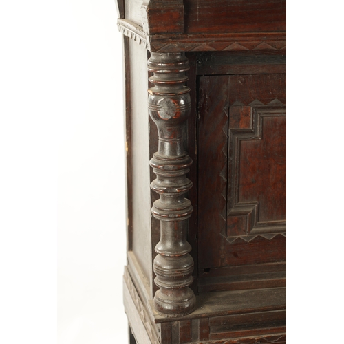 433 - A 17TH CENTURY OAK BUFFET with moulded fronts and ring turned supports above an open bottom shelf (1... 