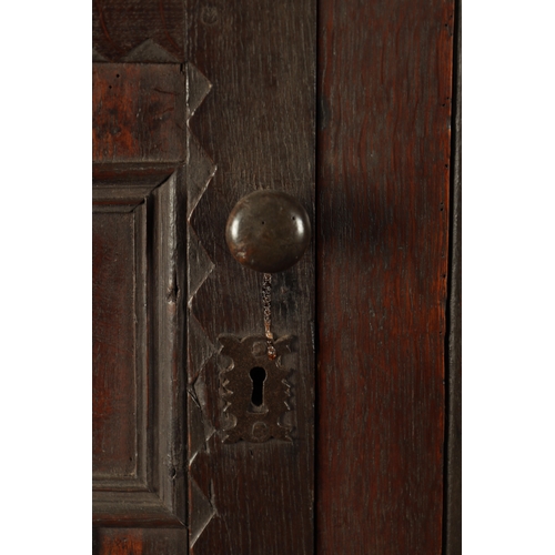 433 - A 17TH CENTURY OAK BUFFET with moulded fronts and ring turned supports above an open bottom shelf (1... 