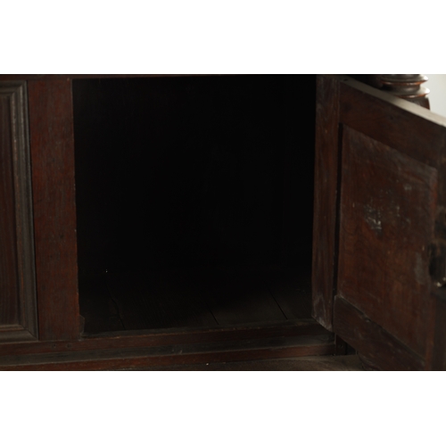 433 - A 17TH CENTURY OAK BUFFET with moulded fronts and ring turned supports above an open bottom shelf (1... 