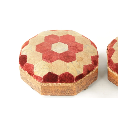 439 - A PAIR OF REGENCY 'BULLOCK' INSPIRED PENWORK UPHOLSTERED FOOTSTOOLS of octagonal form on brass ball ... 