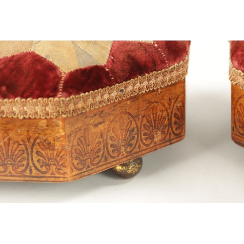 439 - A PAIR OF REGENCY 'BULLOCK' INSPIRED PENWORK UPHOLSTERED FOOTSTOOLS of octagonal form on brass ball ... 