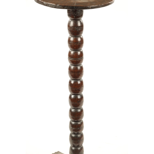 441 - A RARE LATE 17TH CENTURY OAK BOBBIN STEM CANDLE STAND with circular top having geometric scratch mar... 