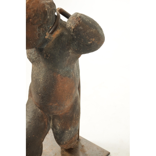 445 - AN EARLY 18TH CENTURY TERRACOTTA FIGURE OF STANDING CHERUB mounted on a later iron stand