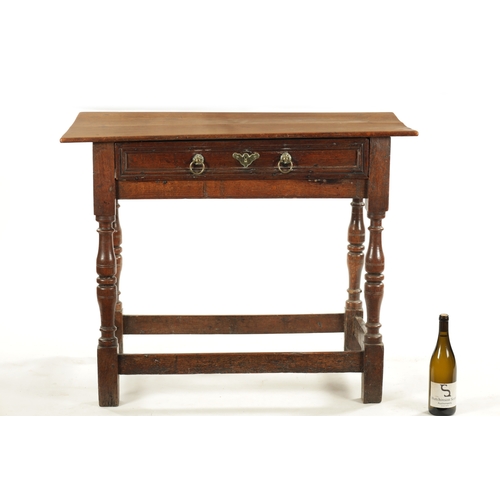 448 - A LATE 17TH CENTURY ELM SIDE TABLE with moulded top drawer; raised on ring turned legs joined by und... 