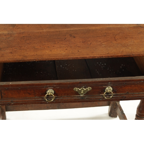 448 - A LATE 17TH CENTURY ELM SIDE TABLE with moulded top drawer; raised on ring turned legs joined by und... 