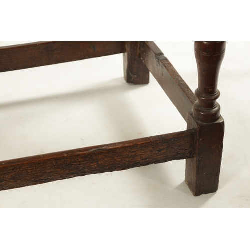 448 - A LATE 17TH CENTURY ELM SIDE TABLE with moulded top drawer; raised on ring turned legs joined by und... 