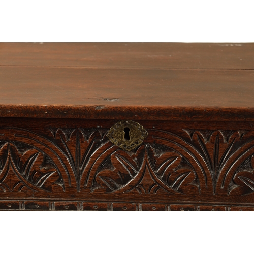 48 - A RARE 17TH CENTURY JOINED OAK BOX TOP SIDE TABLE the hinged top above a leaf carved arcaded frieze;... 