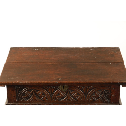 48 - A RARE 17TH CENTURY JOINED OAK BOX TOP SIDE TABLE the hinged top above a leaf carved arcaded frieze;... 