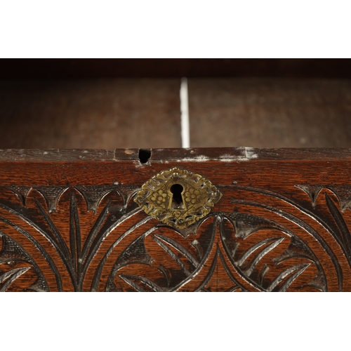 48 - A RARE 17TH CENTURY JOINED OAK BOX TOP SIDE TABLE the hinged top above a leaf carved arcaded frieze;... 