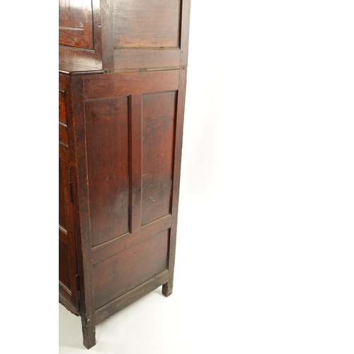 50 - AN 18TH CENTURY OAK DUODARN with arched triple panel top, two frieze drawers and panels cupboard bas... 