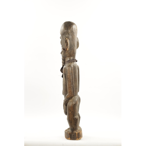 54 - AN ANTIQUE NIGERIAN MALE FERTILITY FIGURE from the Eric Mayes Collection (87cm high)