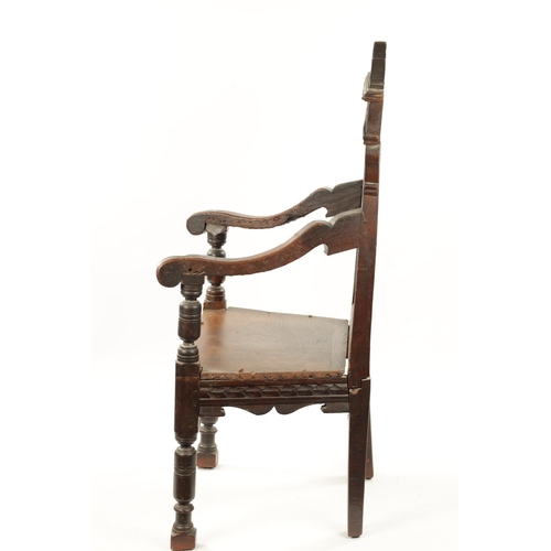 55 - A 17TH CENTURY CARVED OAK WAINSCOT CHAIR having leaf carved back and plank seat; open arms and turne... 