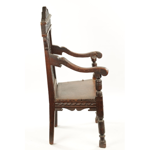 55 - A 17TH CENTURY CARVED OAK WAINSCOT CHAIR having leaf carved back and plank seat; open arms and turne... 