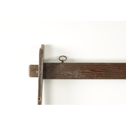 57 - AN 18THN CENTURY OAK WALL HANGING WHIP RACK (154cm high 82cm wide)