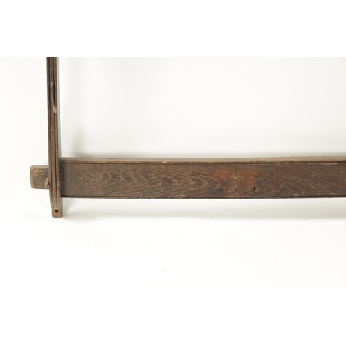 57 - AN 18THN CENTURY OAK WALL HANGING WHIP RACK (154cm high 82cm wide)