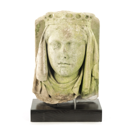 66 - AN 18TH CENTURY CARVED STONE HEAD POSSIBLY GUINEVERE (the head 34cm high 24cm wide)