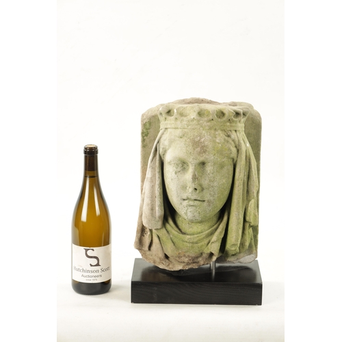 66 - AN 18TH CENTURY CARVED STONE HEAD POSSIBLY GUINEVERE (the head 34cm high 24cm wide)