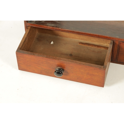 70 - A SET OF EARLY 19TH CENTURY WALNUT WALL SHELVES fitted with two bottom drawers (86cm high 54cm wide)