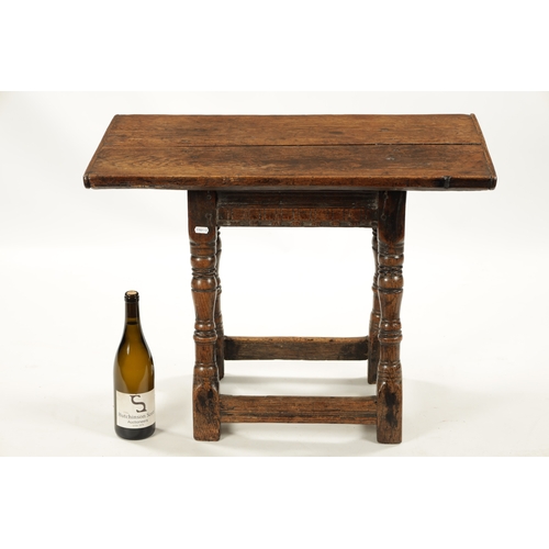 72 - A RARE 17TH CENTURY JOINED OAK TAVERN STOOL/TABLE with overhanging plank top above a ring turned bas... 