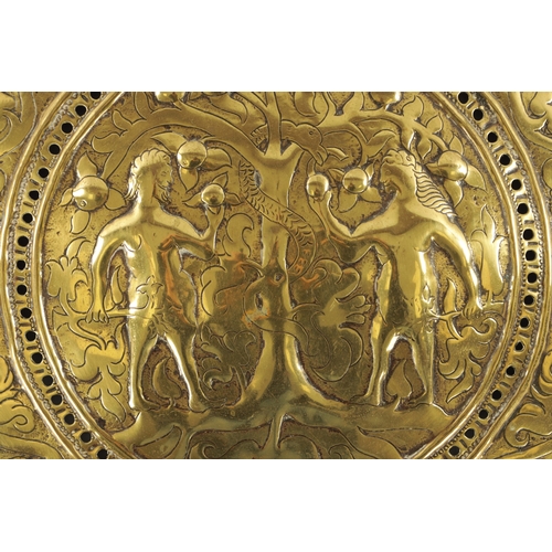 73 - A LATE 17TH CENTURY ADAM & EVE EMBOSSED HANGING WALL LIGHT PLAQUE with scrollwork border (30cm diame... 