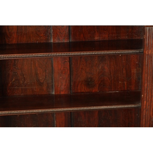 75 - A REGENCY FIGURED ROSEWOOD OPEN BOOKCASE OF SMALL SIZE with marble top above three shelves supported... 