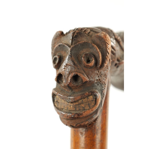 77 - A RARE TWO HEADED GROTESQUE 19TH CENTURY AFRICAN WALKING STICK (89cm overall)