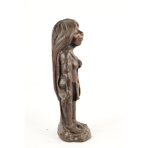 78 - AN UNUSUAL 19TH CENTURY FOLK ARK CARVED WALNUT FIGURE OF A MYTHICAL FEMALE with bone inlaid eyes (26... 