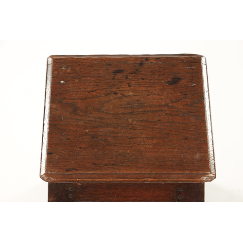 84 - A 17TH CENTURY OAK BOX STOOL of tapering form with panlled sides. (51cm high 34cm sqaure at base)