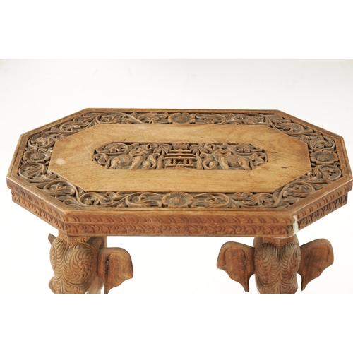 88 - A 19TH CENTURY CARVED HARDWOOD INDIAN OCCASIONAL TABLE raised on elephant's head supports and bone t... 