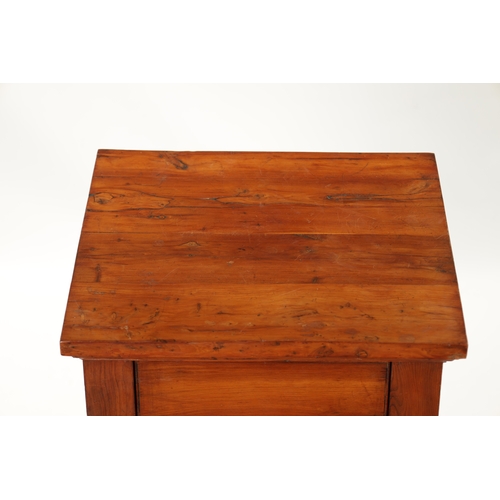 90 - AN 18TH CENTURY EMPIRE STYLE YEW-WOOD BEDSIDE CABINET with cupboard centre and outset columns (41cm ... 