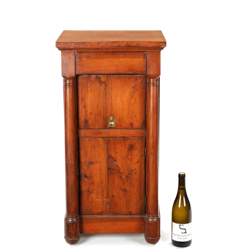 90 - AN 18TH CENTURY EMPIRE STYLE YEW-WOOD BEDSIDE CABINET with cupboard centre and outset columns (41cm ... 