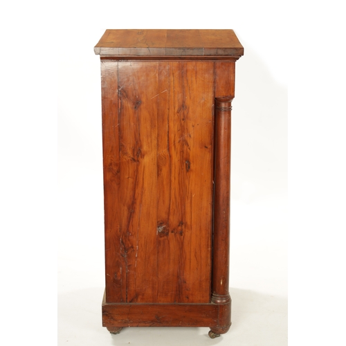 90 - AN 18TH CENTURY EMPIRE STYLE YEW-WOOD BEDSIDE CABINET with cupboard centre and outset columns (41cm ... 