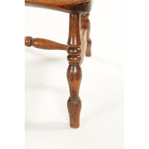 91 - A 19TH CENTURY CHILD'S STICK-BACK WINDSOR CHAIR having elm seat and ring-turned legs (77cm high 47cm... 