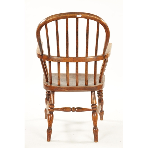 91 - A 19TH CENTURY CHILD'S STICK-BACK WINDSOR CHAIR having elm seat and ring-turned legs (77cm high 47cm... 