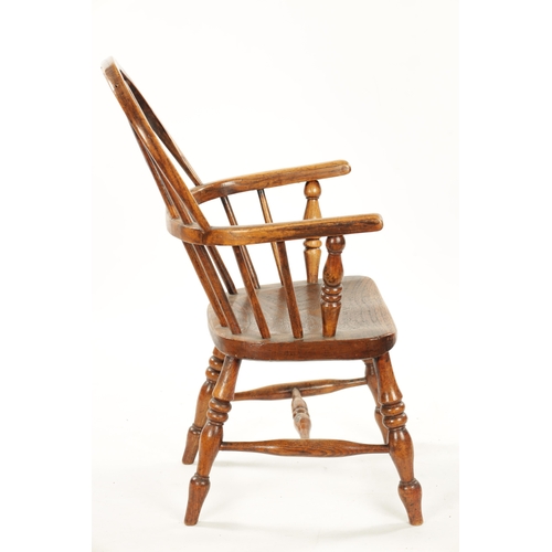 91 - A 19TH CENTURY CHILD'S STICK-BACK WINDSOR CHAIR having elm seat and ring-turned legs (77cm high 47cm... 