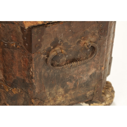 96 - A 17TH CENTURY ITALIAN LEATHER BOUND CASKET with unusual hinged front bearing double locks, side han... 